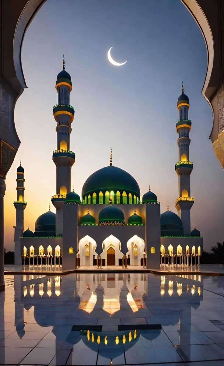 Illuminated mosque under a crescent moon